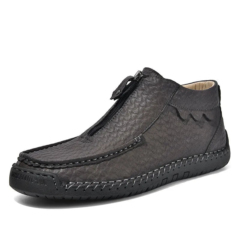 Men's black slip-on leather loafers with round toe and rubber sole, displayed on a white background.