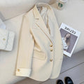 Women's loose fit Korean style coat in milky white, showing long sleeves and pockets.