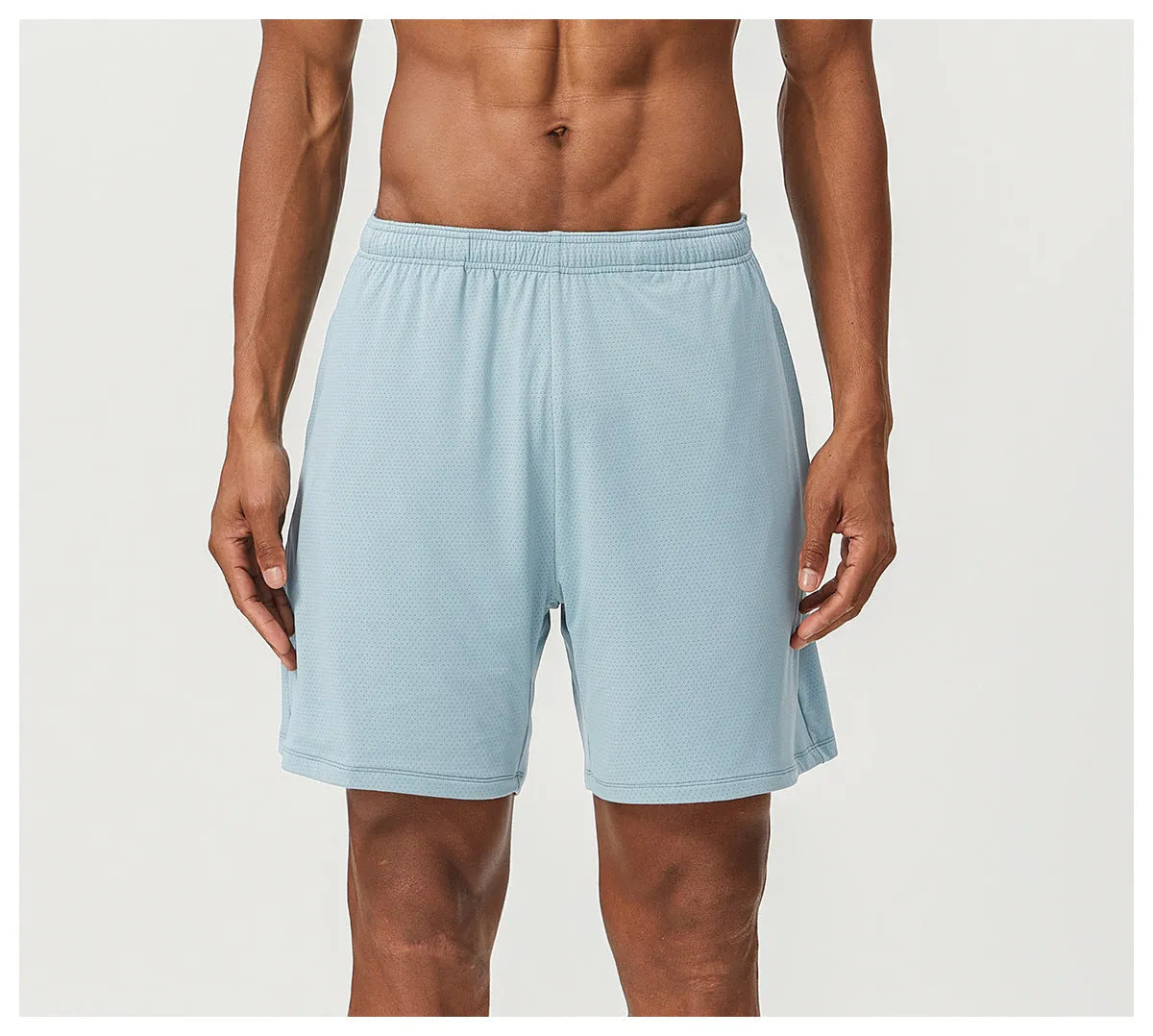 Men's quick-dry double-layer running shorts in a brick red colour on a mid-waist fit model.