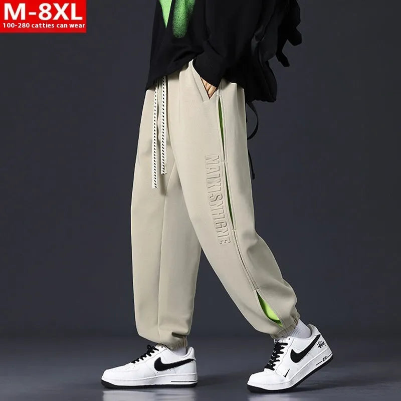 Men's loose cotton trousers with stitching detailing and ankle banding in grey green colour