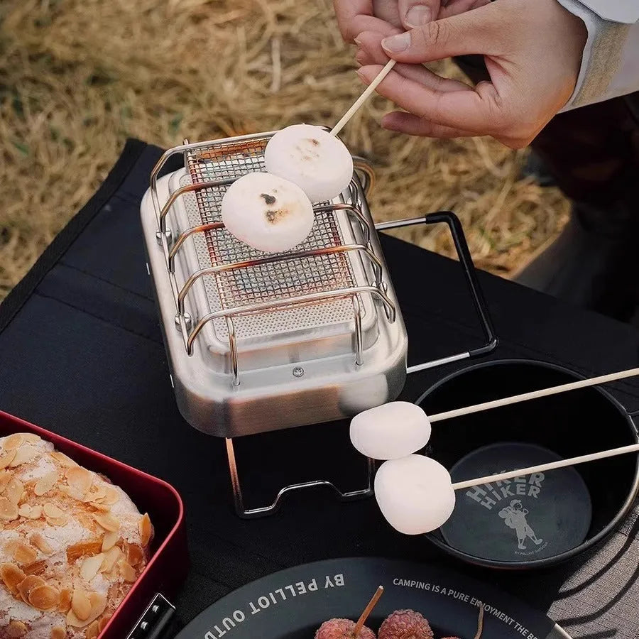 Outdoor heating stove with voltage regulator showing metal construction and compact folded design