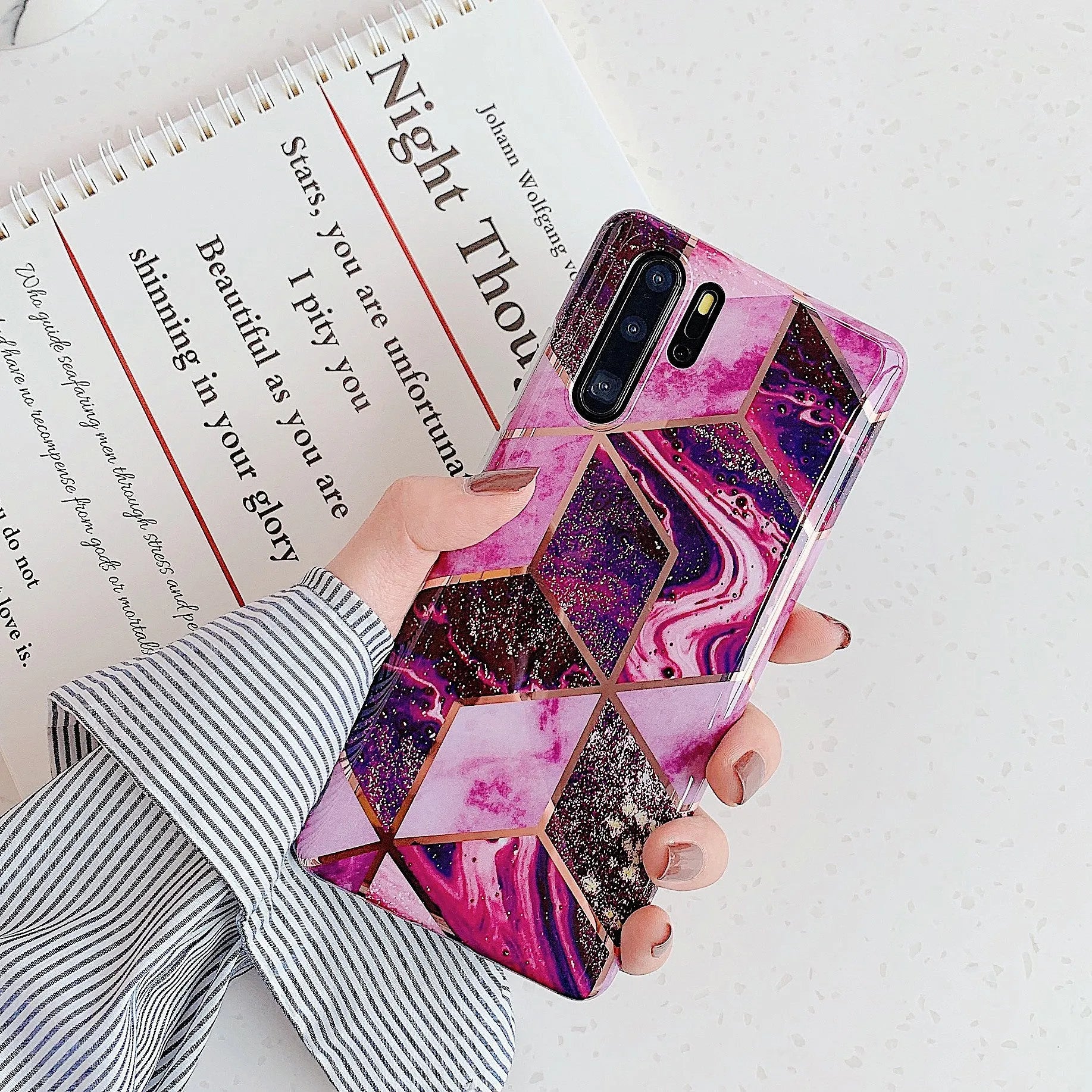 Electroplated marble pattern TPU back cover case for a Huawei or Samsung smartphone.