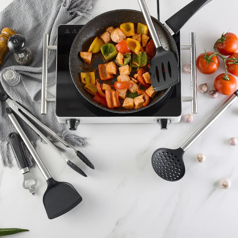 Black kitchen spatula and spoon set with stainless steel handles and silicone heads