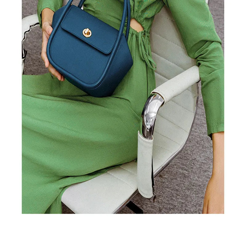 Women's cow leather wing handbag with cross-body strap and hand handles in black colour option