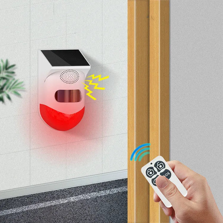Solar powered infrared alarm with wireless remote control for outdoor property protection