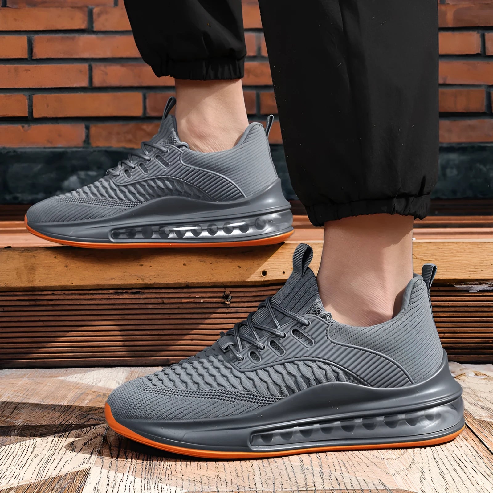 Men's black low-top mesh running shoes with a round toe and lace-up front on a white background.