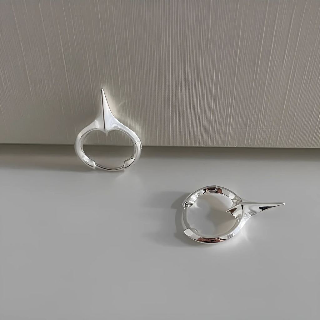 Platinum coloured geometric star shaped ear clips for women with a white gold plated finish