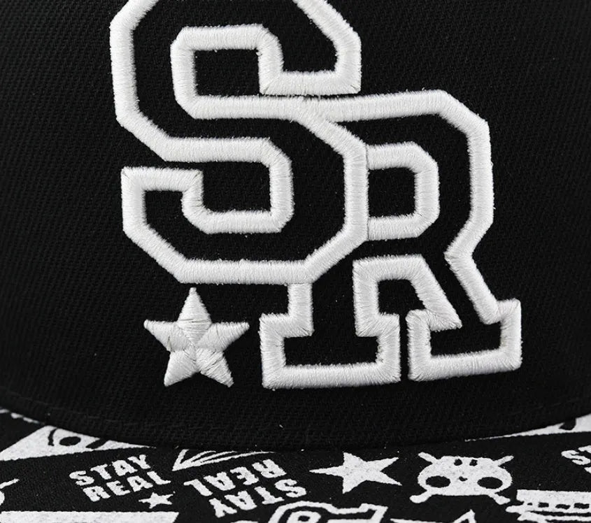 Adjustable black cotton baseball cap with white letter embroidery on the front, showing dome crown shape.