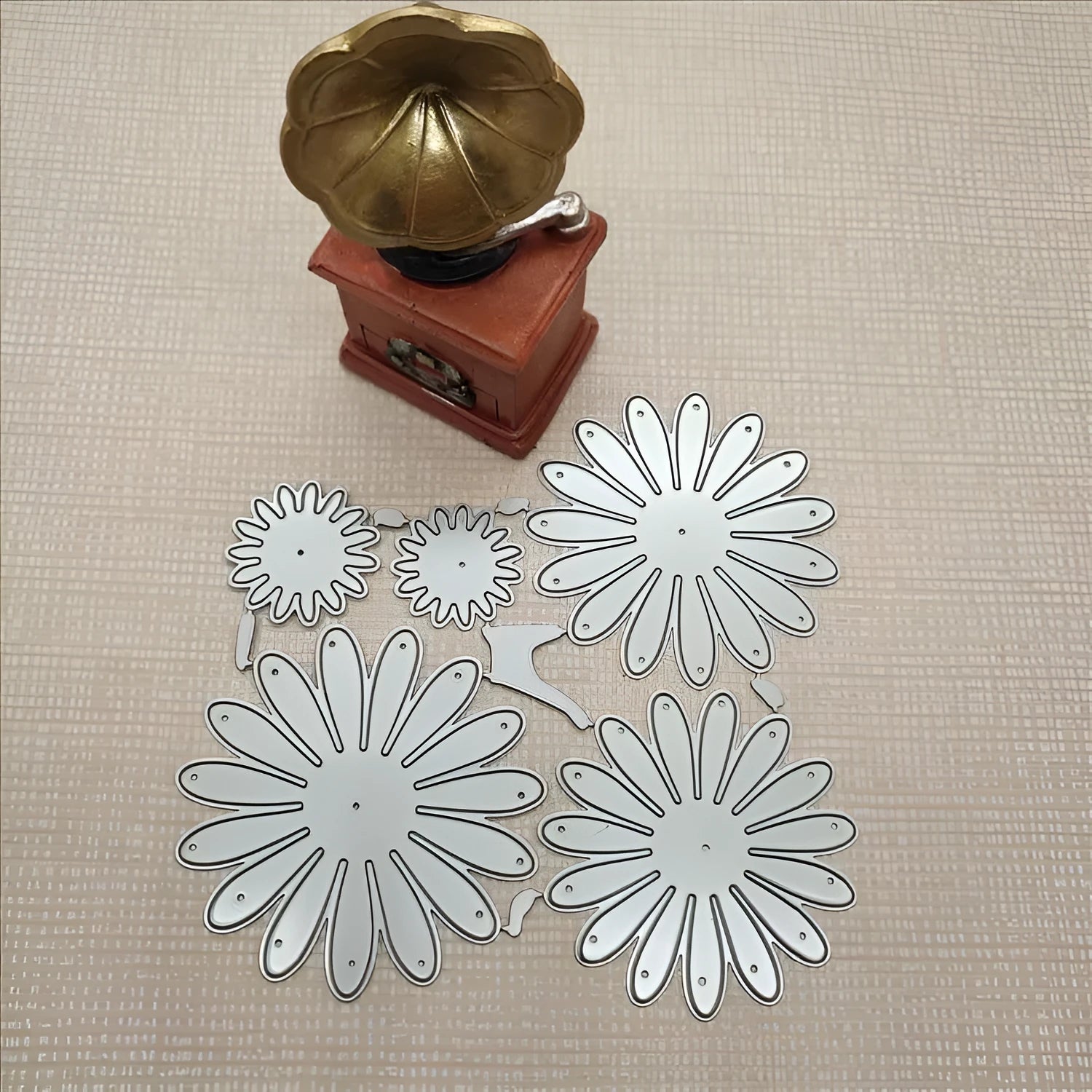 Silver high carbon steel flower combination cutting die mould measuring 12.5 by 13 cm