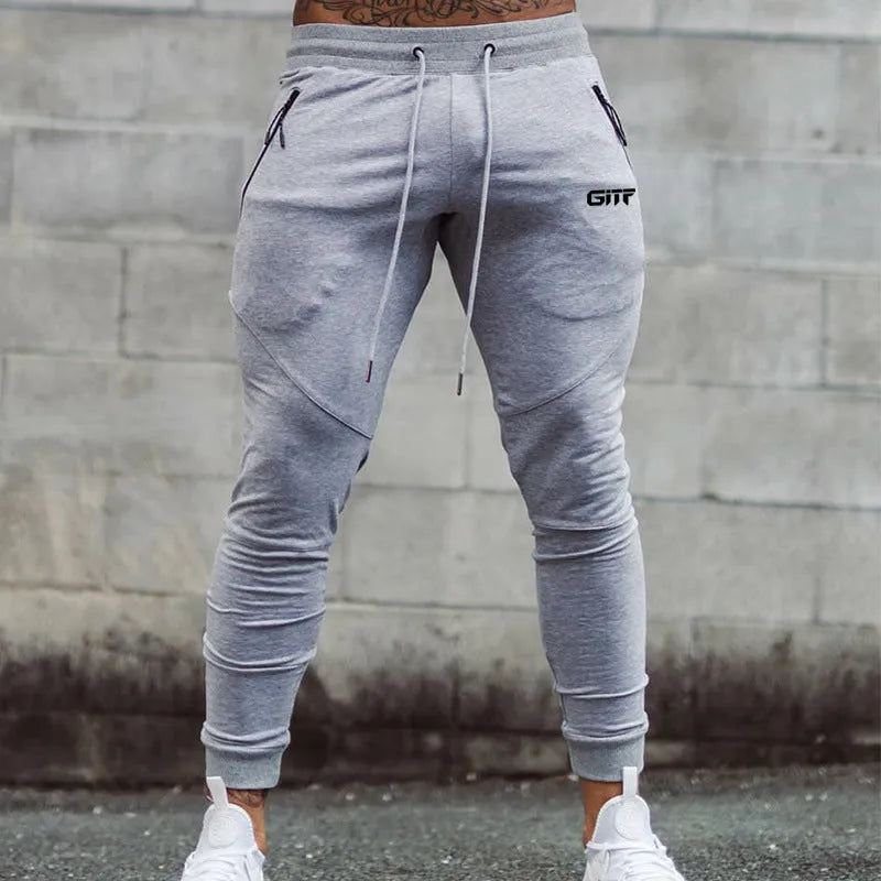 Men's camouflage quick dry jogging trousers in slim fit style from front view on plain background