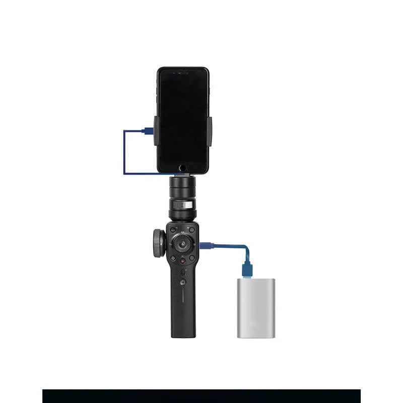 Black handheld smartphone gimbal stabilizer on a table
