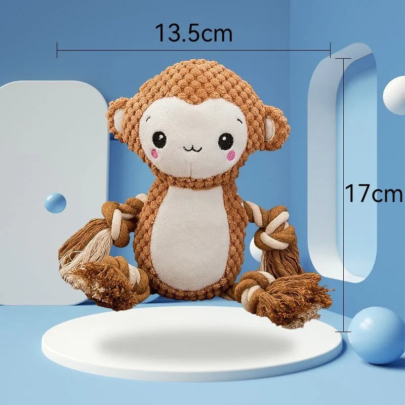 Two stuffed squeaky dog toys: a yellow lion and a brown monkey plush toy on a white background.