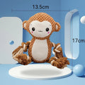 Two stuffed squeaky dog toys: a yellow lion and a brown monkey plush toy on a white background.