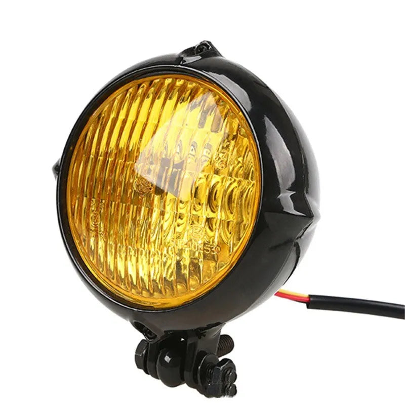 Black retro Harley-style halogen headlight for cars with yellow glass lens.