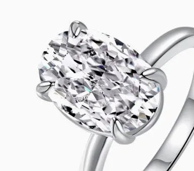 Oval gemstone ring for women in sterling silver with a four-claw setting, shown in gold and silver plating options.