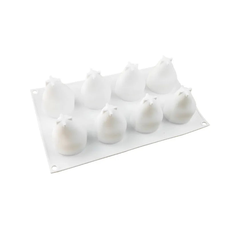 Set of six silicone baking moulds showing pineapple, pine cone, and pear shapes for desserts.