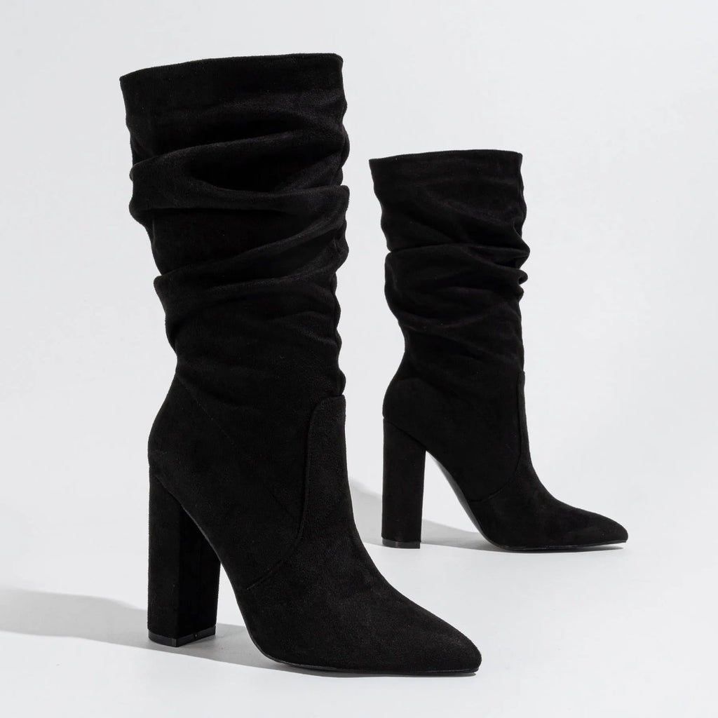 Black suede women's boots with a chunky high heel and pointed toe.