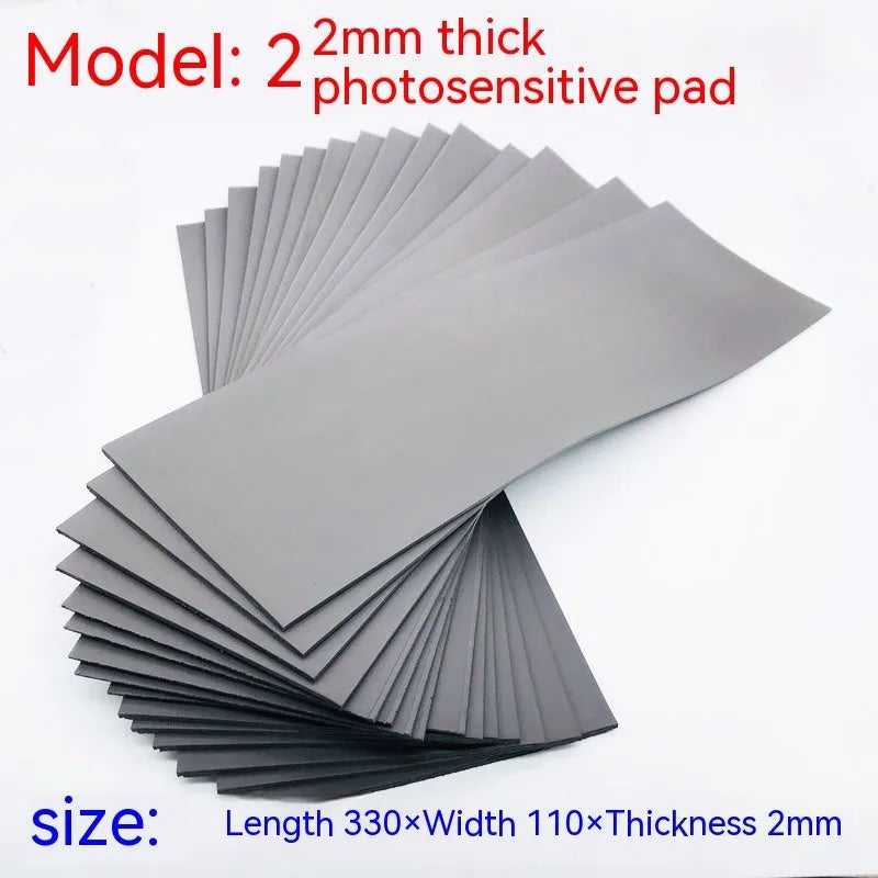 Black plastic light-sensitive mat for calligraphy stamp making, showing three thickness options.