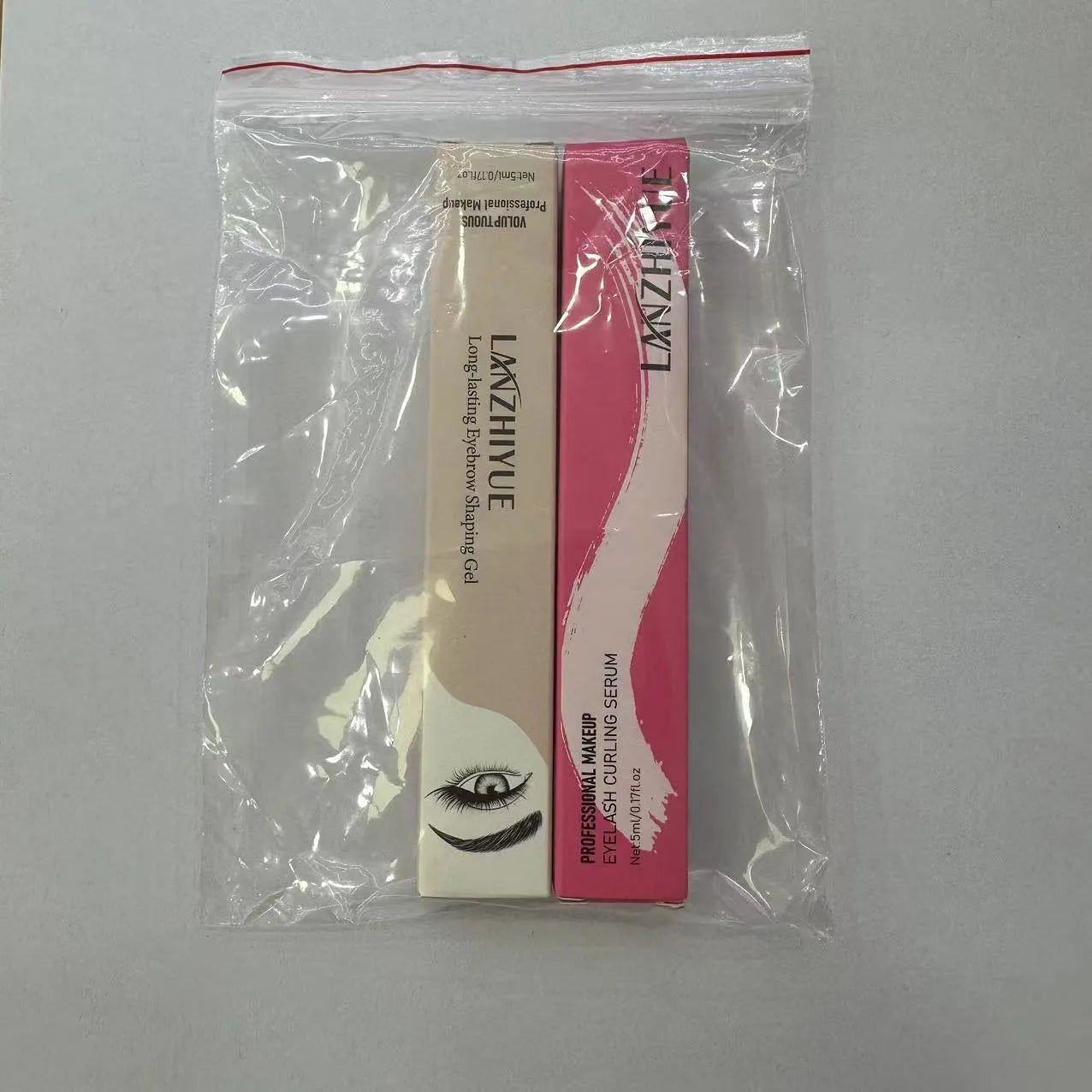 White eyelash growth liquid bottle for eyelash thickening and lengthening treatment