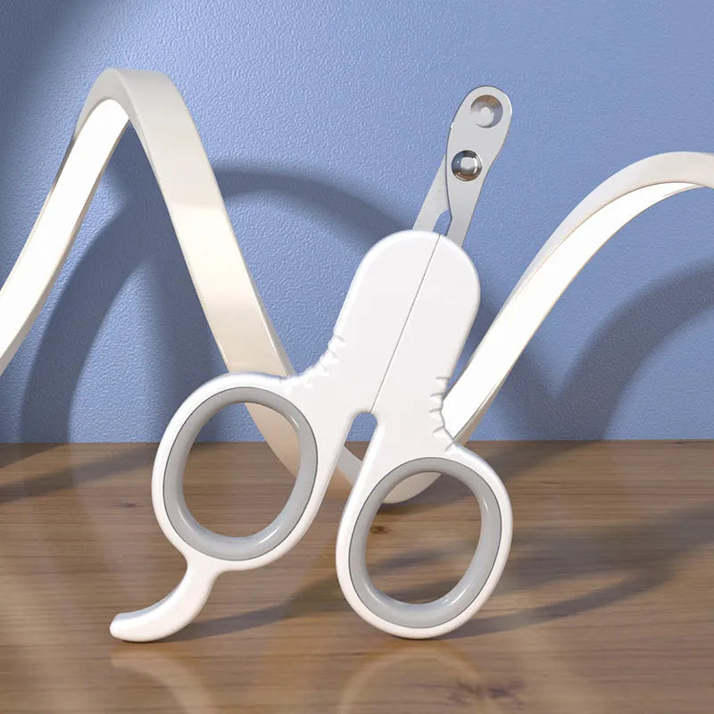 Grey and pink pet nail clippers with curved tips and a rubber-coated anti-slip handle on a white background.