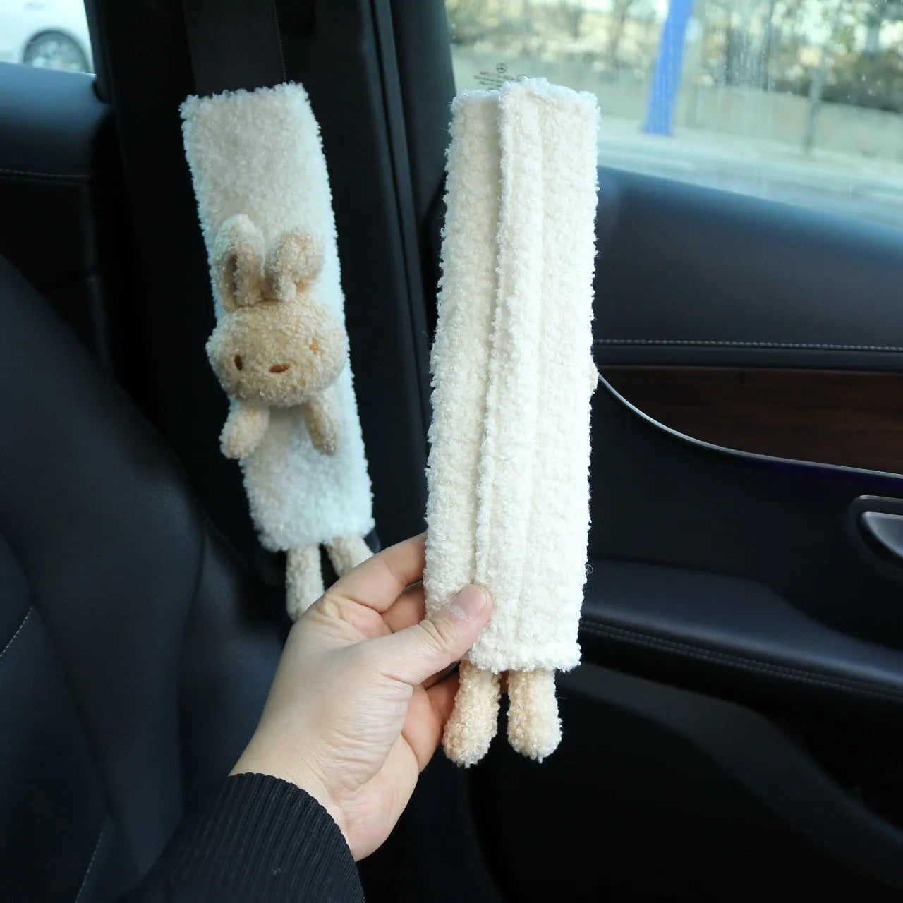 Cartoon plush seat belt shoulder protector in lamb wool with bear and rabbit designs.