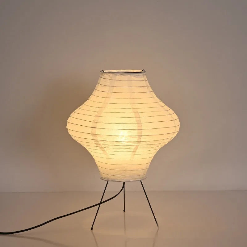 Silent Wind Japanese style Xuan paper table lamp with soft white glow on a wooden table.