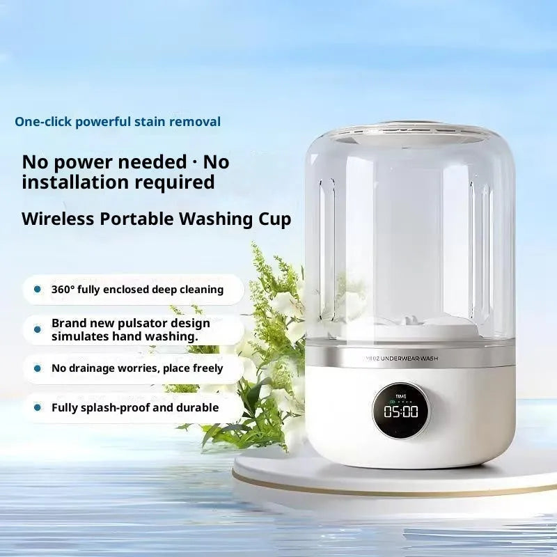 White portable laundry cup rechargeable small washing machine with charging cable on a table
