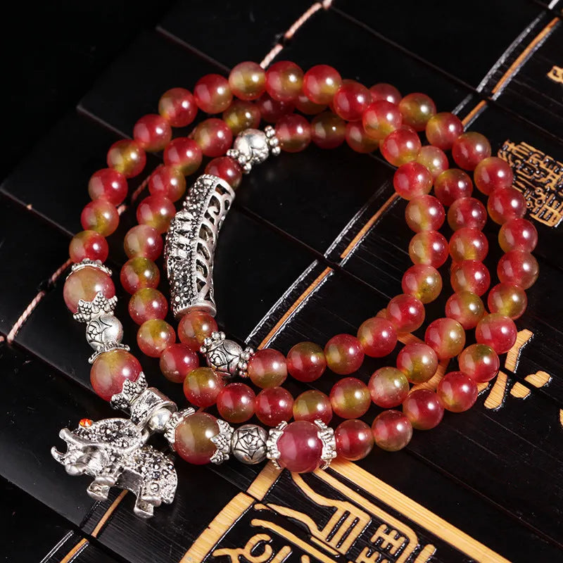 Handmade watermelon crystal bracelet with Chinese knot in 8mm or 6mm elephant style beads.