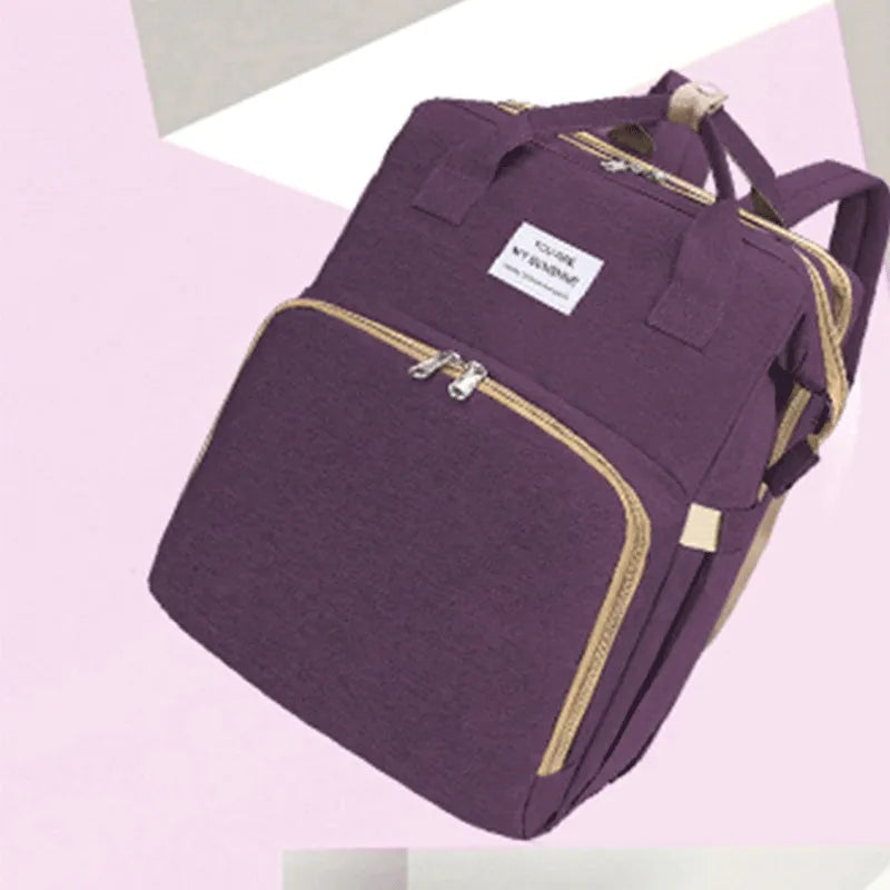 Lightweight nylon mother and baby bag with USB port, curved shoulder strap, shown in blue colour.