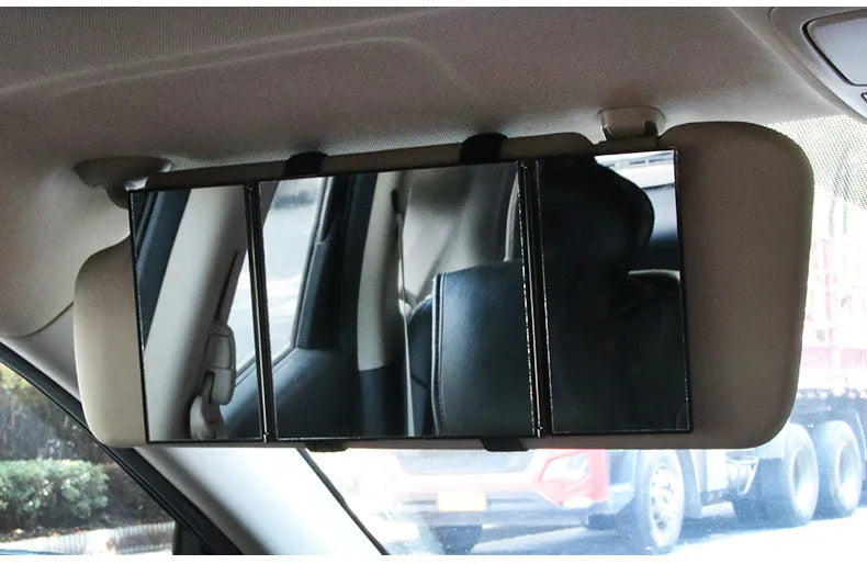 Silver folding car makeup mirror shown closed and opened, highlighting its compact and large glass sizes.