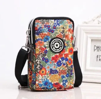 Vertical mobile phone bag in black with Oxford Spinning texture and zipper closure