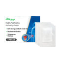 Pack of four herbal foot patches with ginger and mugwort root ingredients on clean skin.