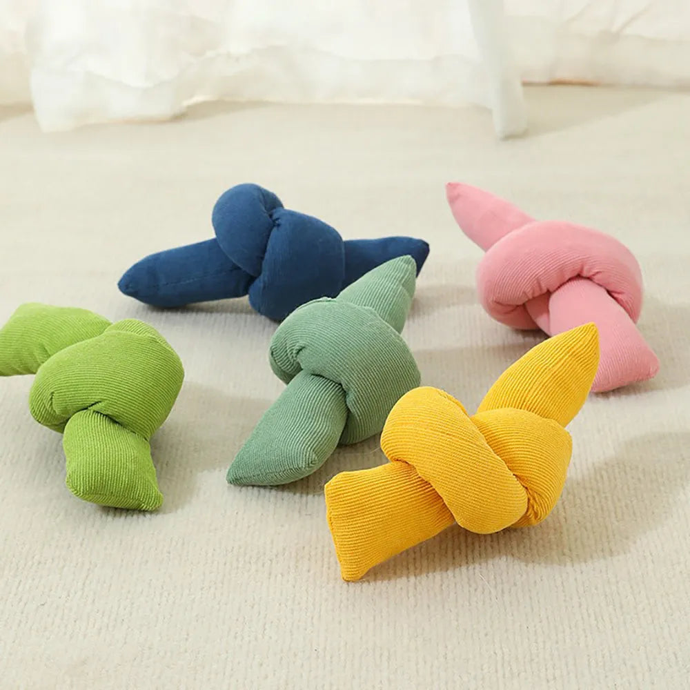 White cotton dog rope toy with multiple knots for tug games and dental flossing