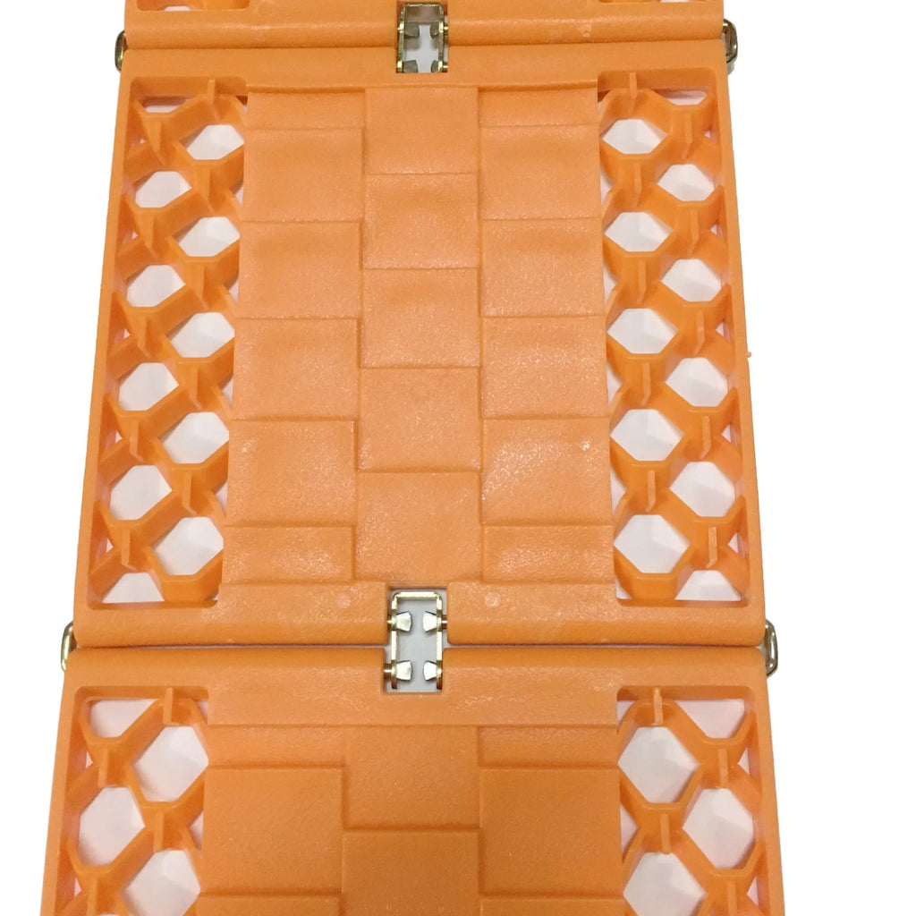 Orange folding vehicle rescue board showing rubber grip surface and folded size