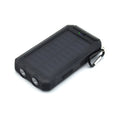 Solar power bank with dual LED headlights and compass display, shown in black colour.
