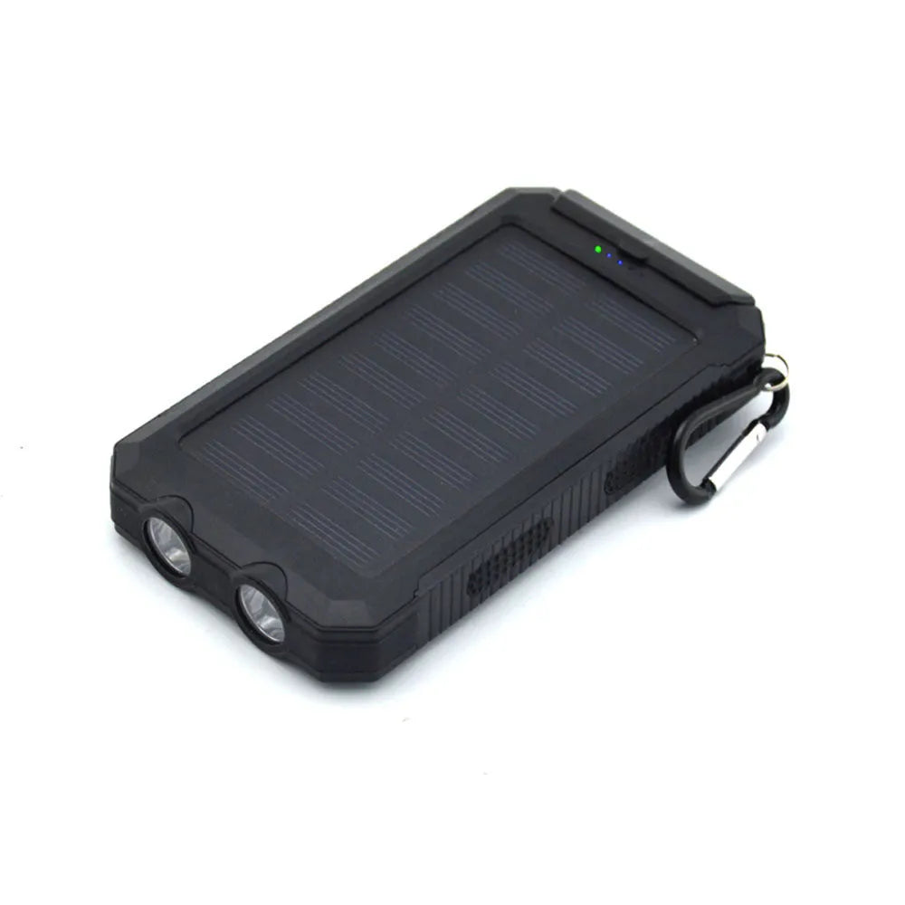 Solar power bank with dual LED headlights and compass display, shown in black colour.