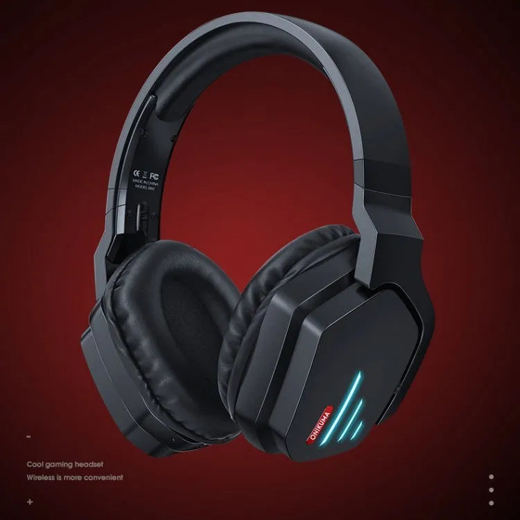 Luminous black wireless over-ear headphones with headband, shown with included 3.5mm cable and dust bag.