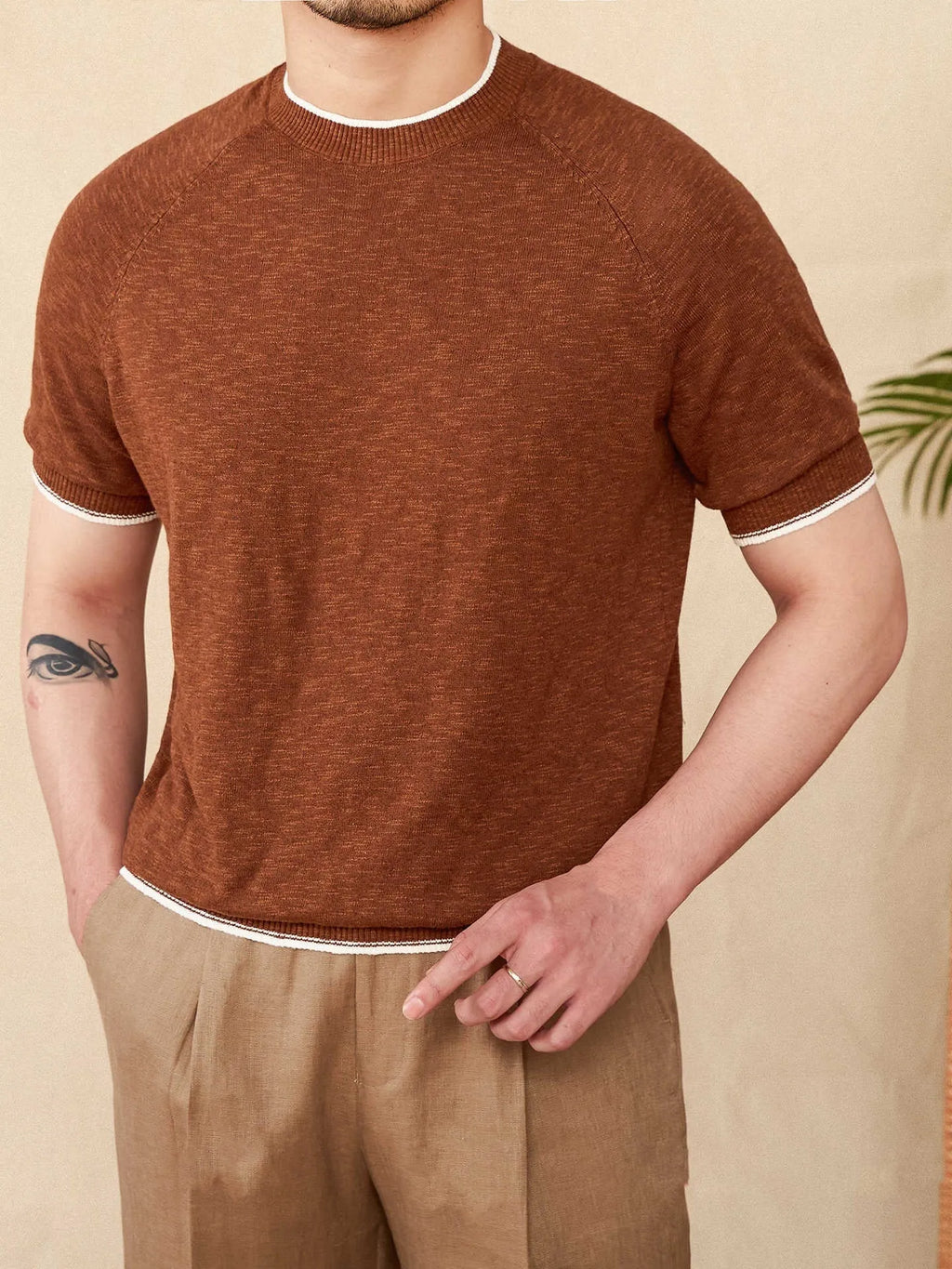 Brown linen cotton blend casual t-shirt with round neck and short sleeves on hanger