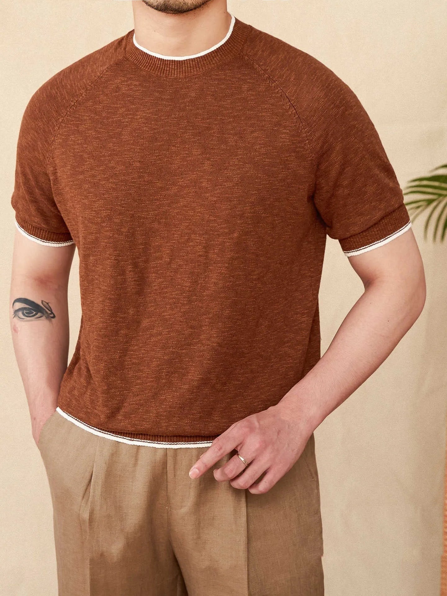 Brown linen cotton blend casual t-shirt with round neck and short sleeves on hanger
