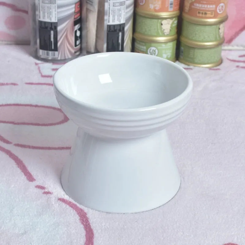 White ceramic pet bowl with a high foot neck and slanted rim for cat or dog feeding