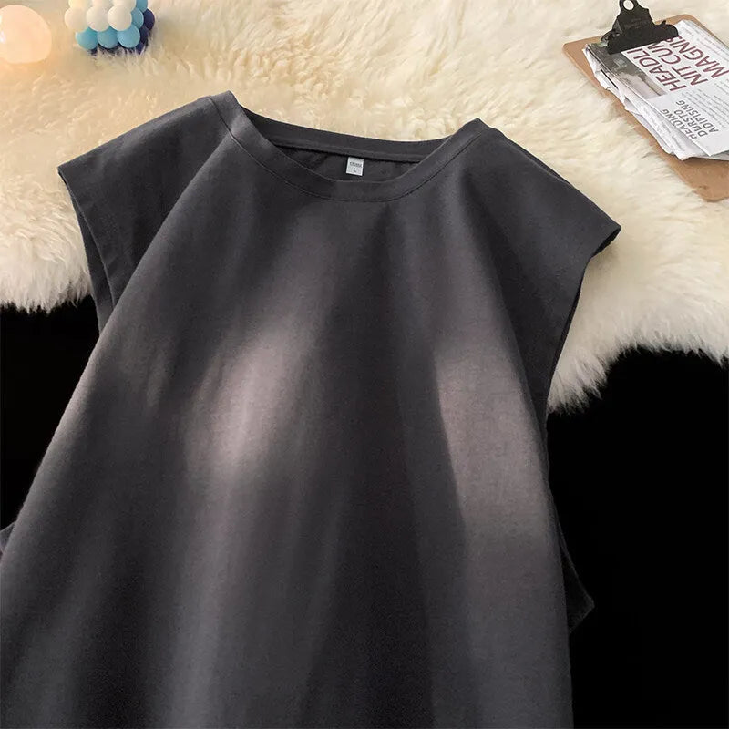 Men's loose solid colour cotton tank top on a hanger, showing straight hem and sleeveless design.