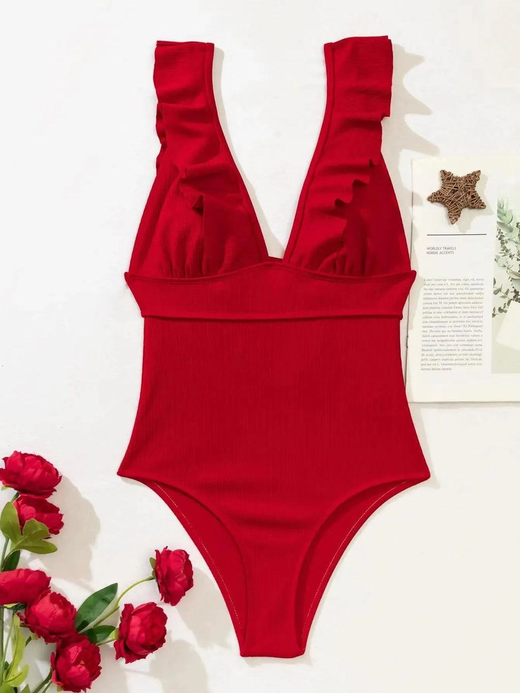 Women's black one-piece swimsuit with ruffled adjustable shoulder straps and back lace fastening.