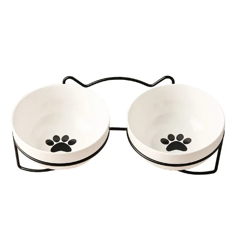 Ceramic cat bowl in an iron frame, showing cat paw print and fishbone pattern options