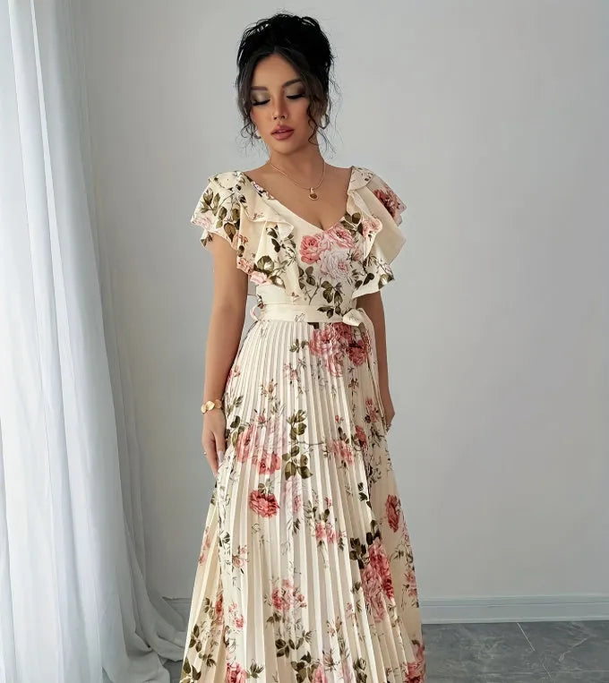Apricot floral print women's dress with v-neck, ruffled sleeves, and a high-waisted long swing skirt.
