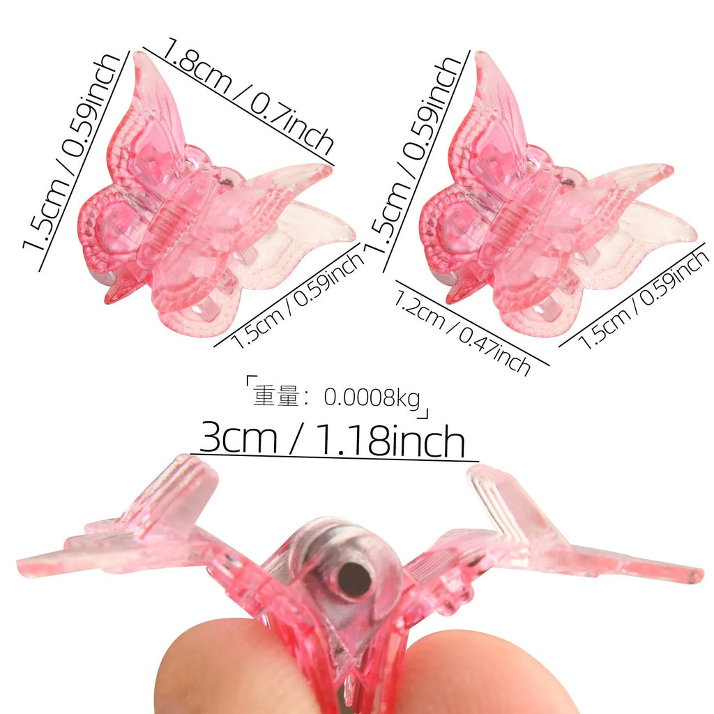 Set of glitter butterfly hair claw clips in assorted colours showing miniature size