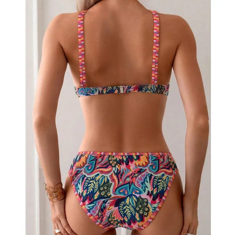 Women's printed halter neck swimsuit with mixed colour design and matching T pants.