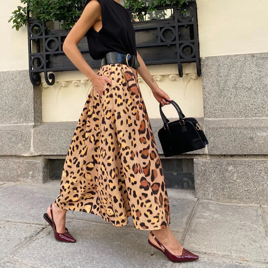Brown leopard print women's A-line long skirt with a flared big hem, shown on a model.
