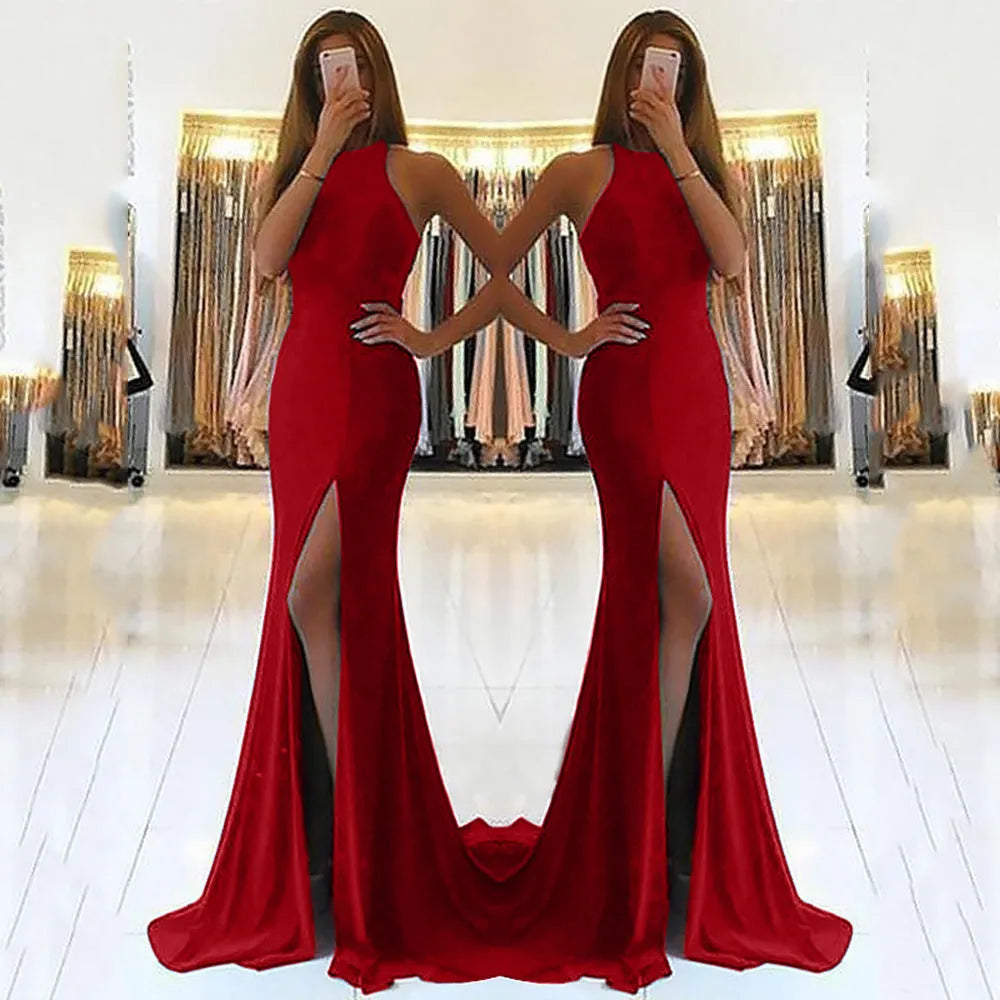 Red knitted long evening dress with high waist, large swing skirt, and hollow out detail on a mannequin.