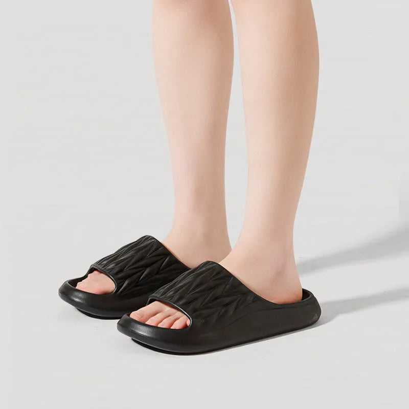 Leaf texture design EVA foam indoor slippers in assorted colours on a white background.