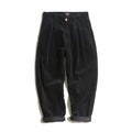 Men's straight-leg corduroy trousers in army green, showing front zipper fly and textured fabric.